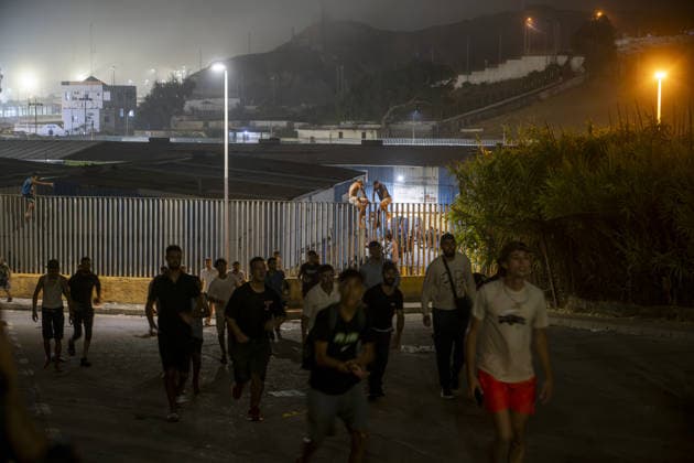 Hundreds of migrants reach Spain s Ceuta after swimming from Morocco CEUTA, SPAIN - JULY 30: Hundreds of migrants have attempted to swim from Morocco to the Spanish city of Ceuta in North Africa, while the number of arrivals exceeded 1,500 in just over a week, according to local news in Cueta, Spain on July 30, 2026. As Moroccan and Algerian migrants attempted to reach Ceuta by swimming, most were reportedly intercepted by Moroccan patrol boats. Spain s Maritime Rescue Service and the Spanish Red Cross rescued 117 people from the water, while the Civil Guard assisted around 200 others with patrol boats. The Spanish Civil Guard also found two bodies which raised the death toll along Ceuta s coastline so far this year to 29. Marcos Moreno A  Copyright: x2026xAnadoluxMarcosxMorenox