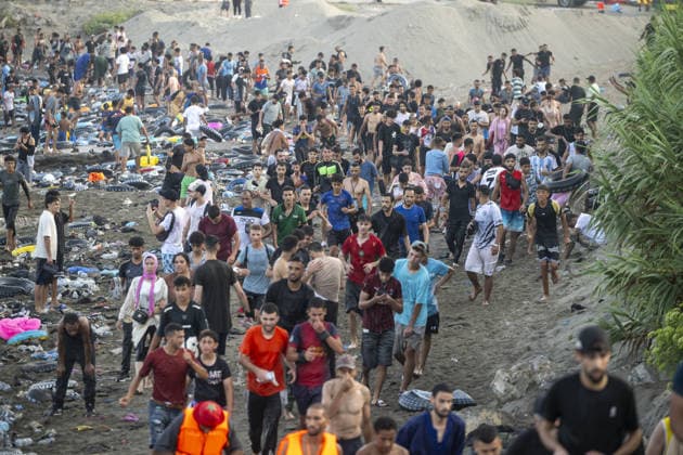 Hundreds of migrants reach Spain s Ceuta after swimming from Morocco CEUTA, SPAIN - JULY 30: Hundreds of migrants have attempted to swim from Morocco to the Spanish city of Ceuta in North Africa, while the number of arrivals exceeded 1,500 in just over a week, according to local news in Cueta, Spain on July 30, 2026. As Moroccan and Algerian migrants attempted to reach Ceuta by swimming, most were reportedly intercepted by Moroccan patrol boats. Spain s Maritime Rescue Service and the Spanish Red Cross rescued 117 people from the water, while the Civil Guard assisted around 200 others with patrol boats. The Spanish Civil Guard also found two bodies which raised the death toll along Ceuta s coastline so far this year to 29. Marcos Moreno A  Copyright: x2026xAnadoluxMarcosxMorenox