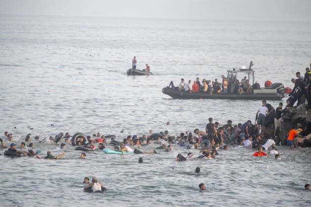 Hundreds of migrants reach Spain s Ceuta after swimming from Morocco CEUTA, SPAIN - JULY 30: Hundreds of migrants have attempted to swim from Morocco to the Spanish city of Ceuta in North Africa, while the number of arrivals exceeded 1,500 in just over a week, according to local news in Cueta, Spain on July 30, 2026. As Moroccan and Algerian migrants attempted to reach Ceuta by swimming, most were reportedly intercepted by Moroccan patrol boats. Spain s Maritime Rescue Service and the Spanish Red Cross rescued 117 people from the water, while the Civil Guard assisted around 200 others with patrol boats. The Spanish Civil Guard also found two bodies which raised the death toll along Ceuta s coastline so far this year to 29. Marcos Moreno A  Copyright: x2026xAnadoluxMarcosxMorenox