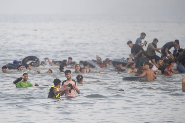 Hundreds of migrants reach Spain s Ceuta after swimming from Morocco CEUTA, SPAIN - JULY 30: Hundreds of migrants have attempted to swim from Morocco to the Spanish city of Ceuta in North Africa, while the number of arrivals exceeded 1,500 in just over a week, according to local news in Cueta, Spain on July 30, 2026. As Moroccan and Algerian migrants attempted to reach Ceuta by swimming, most were reportedly intercepted by Moroccan patrol boats. Spain s Maritime Rescue Service and the Spanish Red Cross rescued 117 people from the water, while the Civil Guard assisted around 200 others with patrol boats. The Spanish Civil Guard also found two bodies which raised the death toll along Ceuta s coastline so far this year to 29. Marcos Moreno A  Copyright: x2026xAnadoluxMarcosxMorenox
