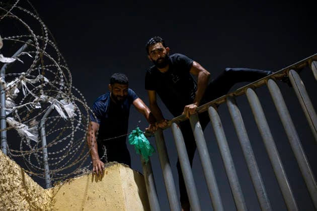 The uncontrolled influx of people into Ceuta from Morocco continues into the night. Several migrants scale the fence marking the border between Ceuta and Morocco on July 31, 2026, in Madrid, Spain. Numerous people continued to enter Ceuta from Morocco unchecked as night fell on Thursday, July 30. From early in the morning, thousands of migrants had entered the autonomous city by swimming and also on foot, skirting the breakwater that separates the autonomous city from Morocco. Border control units in Ceuta have recovered the bodies of 16 people from the water in the last 24 hours, bringing the total to 47 foreigners found dead in Ceuta’s waters while attempting to swim across from Morocco so far this year. JULY 31, 2026 Madrid, Spain  Copyright: xMarcosxMorenox 7696192