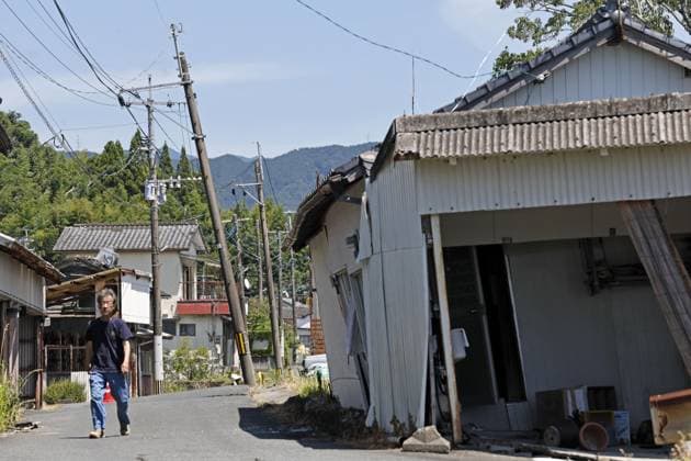 Aftermath of strong earthquake in Kumamoto Tilted electric poles and collapsed houses are pictured in Uki, Kumamoto Prefecture, on July 31, 2026, three days after a powerful earthquake struck the southwestern Japan prefecture.  A14AA0005624703P