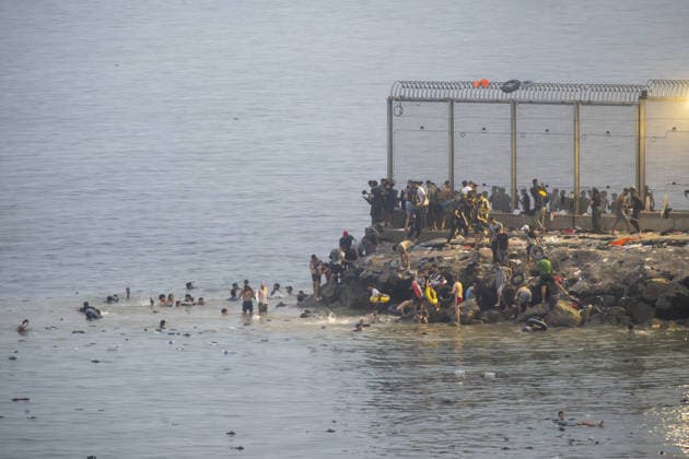 Migrants arrive on shore after attempting sea crossing to Ceuta from Morocco CEUTA, SPAIN - JULY 31: Migrants arrive on the shore of the Spanish city of Ceuta in North Africa after attempting to swim from Morocco on July 31, 2026. Moroccan and Algerian migrants attempted to reach Ceuta by sea, while many were intercepted by Moroccan patrol boats. Spain s Maritime Rescue Service, the Spanish Red Cross, and the Civil Guard carried out rescue operations after the attempted crossings. Marcos Moreno Anadolu Ceuta Spain. Editorial use only. Please get in touch for any other usage.  Copyright: x2026xAnadoluxMarcosxMorenox