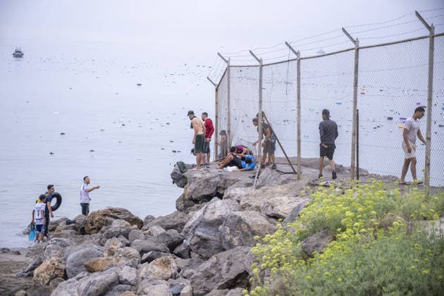 Migrants arrive on shore after attempting sea crossing to Ceuta from Morocco CEUTA, SPAIN - JULY 31: Migrants arrive on the shore of the Spanish city of Ceuta in North Africa after attempting to swim from Morocco on July 31, 2026. Moroccan and Algerian migrants attempted to reach Ceuta by sea, while many were intercepted by Moroccan patrol boats. Spain s Maritime Rescue Service, the Spanish Red Cross, and the Civil Guard carried out rescue operations after the attempted crossings. Marcos Moreno Anadolu Ceuta Spain. Editorial use only. Please get in touch for any other usage.  Copyright: x2026xAnadoluxMarcosxMorenox