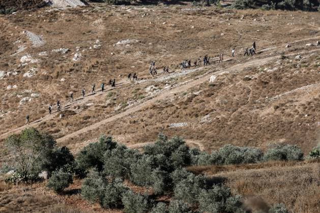 Israeli Settlers Enter Areas of Nablus Under Military Protection NABLUS, West Bank July 31, 2026: Israeli settlers, escorted by Israeli forces, enter the southern and western areas of Nablus in the occupied West Bank on July 31, 2026. NABLUS Palestine, State of Copyright: x xMohammadxRasheedxMansourx xJNAxPressx