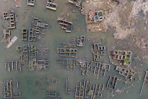 July 31, 2026, Lebak Regency, Banten, Indonesia: An aerial view shows the ruins of Somang village, which have re-emerged as water levels recede during the dry season, amid forecasts that El NioÂ±o may contribute to drier-than-normal conditions, at Karian Reservoir in Sajira district, Lebak Regency, Banten province, Indonesia, July 31, 2026. Lebak Regency Indonesia  - ZUMAp283 20260731_zip_p283_026 Copyright: xClaudioxPramanax