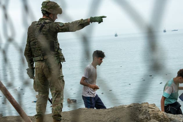 July 31, 2026, Ceuta, Ceuta, Spain: Soldiers monitor the situation as hundreds of migrants attempt to swim from Morocco to the Spanish city of Ceuta in North Africa. Ceuta Spain  - ZUMAd308 20260731_zsp_d308_038 Copyright: xJuanxCarlosxLucasx