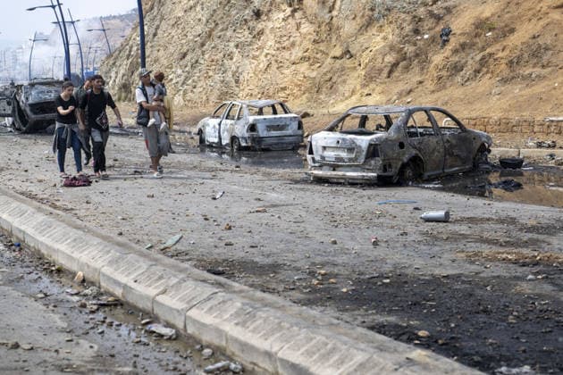 Spain says over 48,300 migrants have returned to Morocco from Ceuta CEUTA, SPAIN - JULY 31: Burned-out vehicles remain on a road near the border with Ceuta as undocumented migrants, mostly young men, who entered Spain s North African enclave of Ceuta illegally, begin returning to Morocco after realizing their chances of obtaining legal status in Spain are unlikely on July 31, 2026. Meanwhile, small groups of migrants continue trying to cross into Ceuta by swimming or climbing the breakwater surrounding the Fnideq coast. More than 48,300 of the approximately 50,000 migrants who entered the Spanish enclave of Ceuta since early Thursday have returned to Morocco by Friday afternoon, Spain s Interior Ministry said, according to EFE news agency.  Copyright: x2026xAnadoluxAbuxAdemxMuhammedx