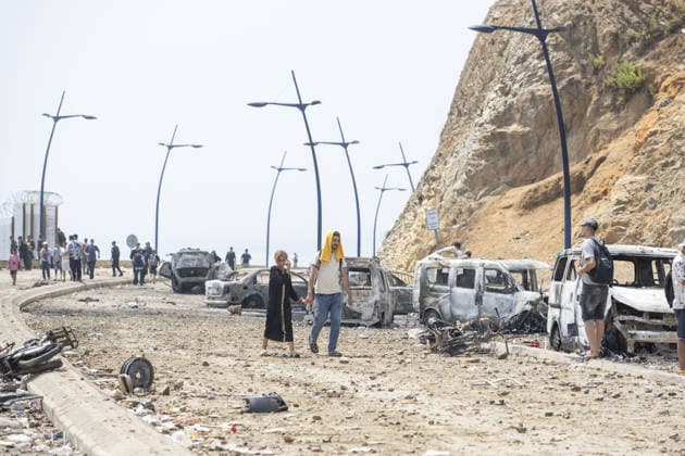 Spain says over 48,300 migrants have returned to Morocco from Ceuta CEUTA, SPAIN - JULY 31: Burned-out vehicles remain on a road near the border with Ceuta as undocumented migrants, mostly young men, who entered Spain s North African enclave of Ceuta illegally, begin returning to Morocco after realizing their chances of obtaining legal status in Spain are unlikely on July 31, 2026. Meanwhile, small groups of migrants continue trying to cross into Ceuta by swimming or climbing the breakwater surrounding the Fnideq coast. More than 48,300 of the approximately 50,000 migrants who entered the Spanish enclave of Ceuta since early Thursday have returned to Morocco by Friday afternoon, Spain s Interior Ministry said, according to EFE news agency.  Copyright: x2026xAnadoluxAbuxAdemxMuhammedx