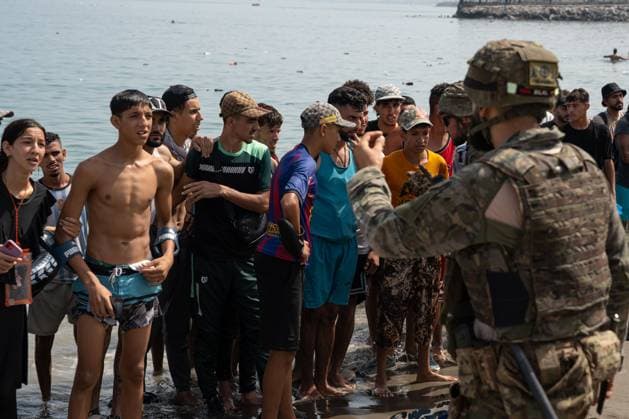 Heavy Migrant Movement at Ceuta Border CEUTA, SPAIN JULY 31, 2026: Migrants gather near the border crossing between Morocco and the Spanish enclave of Ceuta on July 31, 2026. Tens of thousands of migrants crossed into Ceuta from Morocco, while some continued to arrive and others voluntarily returned due to the precarious situation. Ceuta Spain Copyright: x xMarioxMoronx xJNAxPressx