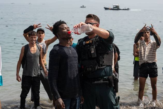 Heavy Migrant Movement at Ceuta Border CEUTA, SPAIN JULY 31, 2026: Migrants gather near the border crossing between Morocco and the Spanish enclave of Ceuta on July 31, 2026. Tens of thousands of migrants crossed into Ceuta from Morocco, while some continued to arrive and others voluntarily returned due to the precarious situation. Ceuta Spain Copyright: x xMarioxMoronx xJNAxPressx