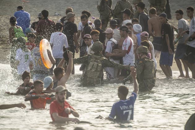 Migrants arrive on shore after attempting sea crossing to Ceuta from Morocco CEUTA, SPAIN - JULY 31: Spanish security forces take measures as migrants arrive on the shore of the Spanish city of Ceuta in North Africa after attempting to swim from Morocco on July 31, 2026. Moroccan and Algerian migrants attempted to reach Ceuta by sea, while many were intercepted by Moroccan patrol boats. Spain s Maritime Rescue Service, the Spanish Red Cross, and the Civil Guard carried out rescue operations after the attempted crossings. Marcos Moreno Anadolu Ceuta Spain. Editorial use only. Please get in touch for any other usage.  Copyright: x2026xAnadoluxMarcosxMorenox