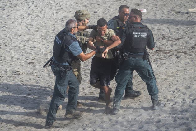 Migrants arrive on shore after attempting sea crossing to Ceuta from Morocco CEUTA, SPAIN - JULY 31: Spanish security forces take measures as migrants arrive on the shore of the Spanish city of Ceuta in North Africa after attempting to swim from Morocco on July 31, 2026. Moroccan and Algerian migrants attempted to reach Ceuta by sea, while many were intercepted by Moroccan patrol boats. Spain s Maritime Rescue Service, the Spanish Red Cross, and the Civil Guard carried out rescue operations after the attempted crossings. Marcos Moreno Anadolu Ceuta Spain. Editorial use only. Please get in touch for any other usage.  Copyright: x2026xAnadoluxMarcosxMorenox