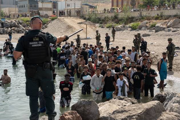 Heavy Migrant Movement at Ceuta Border CEUTA, SPAIN JULY 31, 2026: Migrants gather near the border crossing between Morocco and the Spanish enclave of Ceuta on July 31, 2026. Tens of thousands of migrants crossed into Ceuta from Morocco, while some continued to arrive and others voluntarily returned due to the precarious situation. Ceuta Spain Copyright: x xMarioxMoronx xJNAxPressx