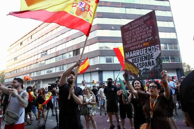 Far-right demonstration outside Moroccan Embassy in Barcelona BARCELONA, SPAIN JULY 31, 2026: Participants attend a demonstration outside the Moroccan Embassy in Barcelona following recent migration developments at Spain s North African enclave of Ceuta. Demonstrators wave Spanish flags, display banners and chant slogans during the protest, while some participants are seen making gestures commonly associated with Nazi salutes. Barcelona Spain Copyright: x xPabloxCarvajalxMunizagax xJNAxPressx