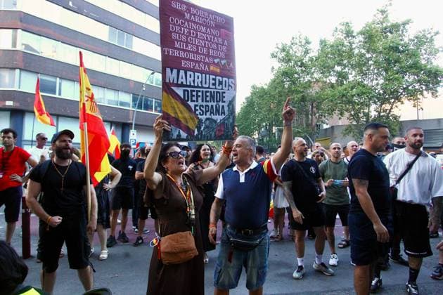 Far-right demonstration outside Moroccan Embassy in Barcelona BARCELONA, SPAIN JULY 31, 2026: Participants attend a demonstration outside the Moroccan Embassy in Barcelona following recent migration developments at Spain s North African enclave of Ceuta. Demonstrators wave Spanish flags, display banners and chant slogans during the protest, while some participants are seen making gestures commonly associated with Nazi salutes. Barcelona Spain Copyright: x xPabloxCarvajalxMunizagax xJNAxPressx