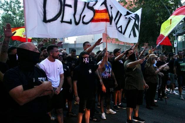 Far-right demonstration outside Moroccan Embassy in Barcelona BARCELONA, SPAIN JULY 31, 2026: Participants attend a demonstration outside the Moroccan Embassy in Barcelona following recent migration developments at Spain s North African enclave of Ceuta. Demonstrators wave Spanish flags, display banners and chant slogans during the protest, while some participants are seen making gestures commonly associated with Nazi salutes. Barcelona Spain Copyright: x xPabloxCarvajalxMunizagax xJNAxPressx