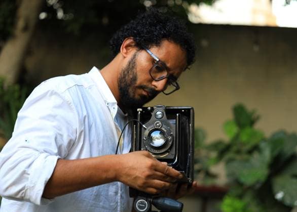 August 1, 2026, Cairo, Egypt: CAIRO, EGYPT Ã¢â‚¬ JULY 2026: Egyptian photojournalist Fareed Kotb poses with his restored 1930 Zeiss Ikon camera in Cairo, Egypt. Kotb gained international recognition for using the nearly century-old camera during his Project 1930, documenting the FIFA World Cup 2026 with a vintage camera manufactured in the same year as the inaugural FIFA World Cup. Cairo Egypt  - ZUMAq101 20260801_zna_q101_003 Copyright: xAbdullahxHamadax