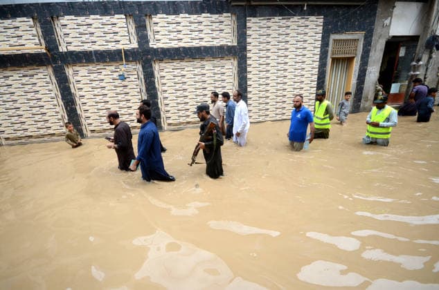 July 31, 2026, Peshawar, Peshawar, Pakistan: Residents wade through flooded street as monsoon rains inundate Peshawar..People wade through a flooded street during heavy monsoon rain in Peshawar, Khyber Pakhtunkhwa province, Pakistan, on July 31, 2026. Pakistan s Meteorological Department (PMD) forecast the current monsoon spell to continue until August 5, warning of widespread rain, thunderstorms, heavy to very heavy downpours, and the risk of urban flooding, flash floods, landslides and river flooding across parts of the country. Peshawar Pakistan  - ZUMAa217 20260731_znp_a217_018 Copyright: xHussainxAlix
