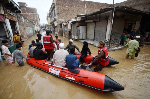 July 31, 2026, Peshawar, Peshawar, Pakistan: Residents wade through flooded street as monsoon rains inundate Peshawar..People wade through a flooded street during heavy monsoon rain in Peshawar, Khyber Pakhtunkhwa province, Pakistan, on July 31, 2026. Pakistan s Meteorological Department (PMD) forecast the current monsoon spell to continue until August 5, warning of widespread rain, thunderstorms, heavy to very heavy downpours, and the risk of urban flooding, flash floods, landslides and river flooding across parts of the country. Peshawar Pakistan - ZUMAa217 20260731_znp_a217_024 Copyright: xHussainxAlix