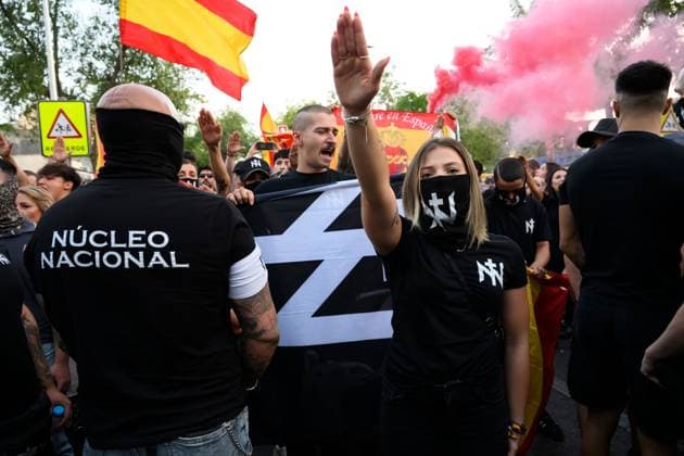 July 31, 2026, Madrid, Spain: Participants attend a demonstration outside the Moroccan Embassy in Madrid, called by the far-right groups Falange Espanola and Nucleo Nacional, following recent migrant arrivals through Spain s North African enclave of Ceuta. Protesters wave Spanish flags, display banners and chant slogans during the demonstration, while some participants are seen making gestures commonly associated with Nazi salutes. Madrid Spain - ZUMAq101 20260731_zna_q101_218 Copyright: xTomasxCallex
