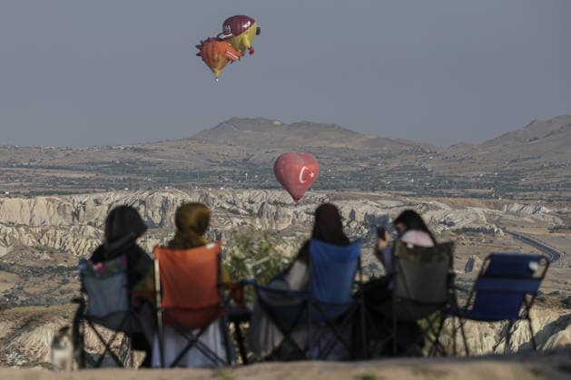 7th Cappadocia Balloon Festival NEVSEHIR, TURKIYE - AUGUST 01: Figure-shaped hot air balloons float above Cappadocia s fairy chimneys during the seventh Cappadocia Balloon Festival, on August 01, 2026 in Nevsehir, Turkiye. Organized by the Ministry of Culture and Tourism, the festival features 30 specially designed balloons brought from Turkiye and several other countries. During sunrise demonstration flights over Goreme, balloons shaped like hearts, owls, parrots, rockets and the Earth attracted the attention of local and international visitors. Osmancan Gurdogan Anadolu Nevsehir Turkey. Editorial use only. Please get in touch for any other usage.  Copyright: x2026xAnadoluxOsmancanxGurdoganx