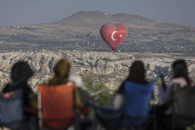 7th Cappadocia Balloon Festival NEVSEHIR, TURKIYE - AUGUST 01: Figure-shaped hot air balloons float above Cappadocia s fairy chimneys during the seventh Cappadocia Balloon Festival, on August 01, 2026 in Nevsehir, Turkiye. Organized by the Ministry of Culture and Tourism, the festival features 30 specially designed balloons brought from Turkiye and several other countries. During sunrise demonstration flights over Goreme, balloons shaped like hearts, owls, parrots, rockets and the Earth attracted the attention of local and international visitors. Osmancan Gurdogan Anadolu Nevsehir Turkey. Editorial use only. Please get in touch for any other usage.  Copyright: x2026xAnadoluxOsmancanxGurdoganx