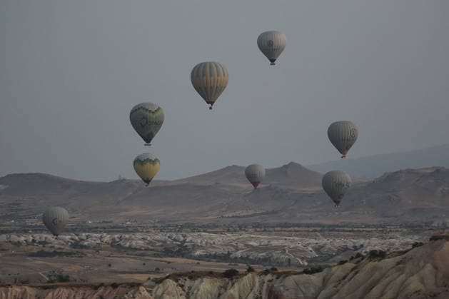 7th Cappadocia Balloon Festival NEVSEHIR, TURKIYE - AUGUST 01: Figure-shaped hot air balloons float above Cappadocia s fairy chimneys during the seventh Cappadocia Balloon Festival, on August 01, 2026 in Nevsehir, Turkiye. Organized by the Ministry of Culture and Tourism, the festival features 30 specially designed balloons brought from Turkiye and several other countries. During sunrise demonstration flights over Goreme, balloons shaped like hearts, owls, parrots, rockets and the Earth attracted the attention of local and international visitors. Osmancan Gurdogan Anadolu Nevsehir Turkey. Editorial use only. Please get in touch for any other usage.  Copyright: x2026xAnadoluxOsmancanxGurdoganx