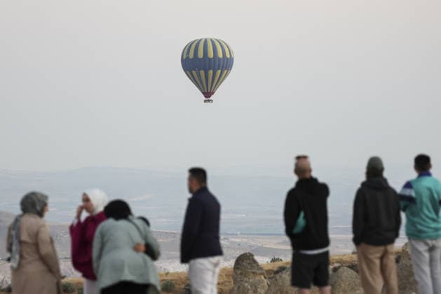7th Cappadocia Balloon Festival NEVSEHIR, TURKIYE - AUGUST 01: Figure-shaped hot air balloons float above Cappadocia s fairy chimneys during the seventh Cappadocia Balloon Festival, on August 01, 2026 in Nevsehir, Turkiye. Organized by the Ministry of Culture and Tourism, the festival features 30 specially designed balloons brought from Turkiye and several other countries. During sunrise demonstration flights over Goreme, balloons shaped like hearts, owls, parrots, rockets and the Earth attracted the attention of local and international visitors. Osmancan Gurdogan Anadolu Nevsehir Turkey. Editorial use only. Please get in touch for any other usage.  Copyright: x2026xAnadoluxOsmancanxGurdoganx
