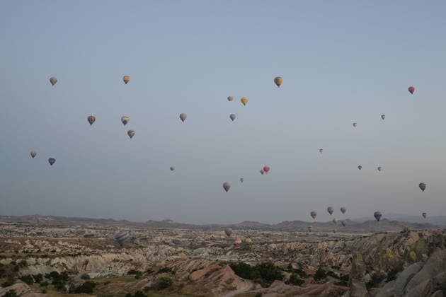 7th Cappadocia Balloon Festival NEVSEHIR, TURKIYE - AUGUST 01: Figure-shaped hot air balloons float above Cappadocia s fairy chimneys during the seventh Cappadocia Balloon Festival, on August 01, 2026 in Nevsehir, Turkiye. Organized by the Ministry of Culture and Tourism, the festival features 30 specially designed balloons brought from Turkiye and several other countries. During sunrise demonstration flights over Goreme, balloons shaped like hearts, owls, parrots, rockets and the Earth attracted the attention of local and international visitors. Osmancan Gurdogan Anadolu Nevsehir Turkey. Editorial use only. Please get in touch for any other usage.  Copyright: x2026xAnadoluxOsmancanxGurdoganx