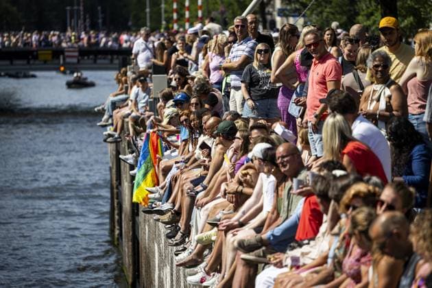 AMSTERDAM - Visitors sit on the quay during the Canal Parade. The boat parade is traditionally part of the Pride celebrations in the capital. RAMON VAN FLYMEN ANP netherlands out - belgium out  Copyright: xx x564680497x originalFilename: 564680497.jpg