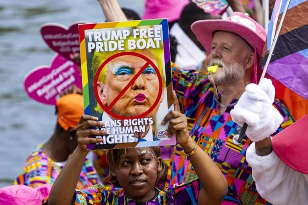 AMSTERDAM - A participant holds up an anti-Trump sign during the Canal Parade. The boat parade is traditionally part of the Pride celebrations in the capital. RAMON VAN FLYMEN ANP netherlands out - belgium out  Copyright: xx x564681255x originalFilename: 564681255.jpg