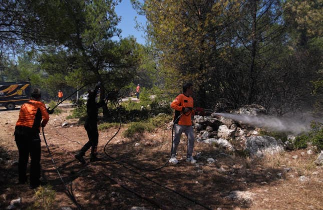 Firefighting efforts continue in Izmir??????? IZMIR, TURKIYE - AUGUST 01: Turkish General Directorate of Forestry teams and firefighters, supported by aircraft, fight a forest fire in the Tinaztepe neighborhood of Buca district in Izmir, Turkiye on August 01, 2026. Aerial and ground teams continue efforts to bring the blaze under control. Berkan Cetin Anadolu Izmir Turkey. Editorial use only. Please get in touch for any other usage.  Copyright: x2026xAnadoluxBerkanxCetinx