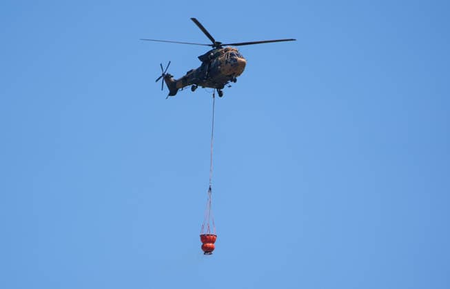 Firefighting efforts continue in Izmir??????? IZMIR, TURKIYE - AUGUST 01: Turkish General Directorate of Forestry teams and firefighters, supported by aircraft, fight a forest fire in the Tinaztepe neighborhood of Buca district in Izmir, Turkiye on August 01, 2026. Aerial and ground teams continue efforts to bring the blaze under control. Berkan Cetin Anadolu Izmir Turkey. Editorial use only. Please get in touch for any other usage.  Copyright: x2026xAnadoluxBerkanxCetinx