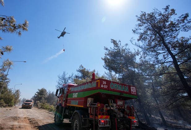 Firefighting efforts continue in Izmir IZMIR, TURKIYE - AUGUST 01: Turkish General Directorate of Forestry teams and firefighters, supported by aircraft, fight a forest fire in the Tinaztepe neighborhood of Buca district in Izmir, Turkiye on August 01, 2026. Aerial and ground teams continue efforts to bring the blaze under control. Berkan Cetin Anadolu Izmir Turkey. Editorial use only. Please get in touch for any other usage.  Copyright: x2026xAnadoluxBerkanxCetinx
