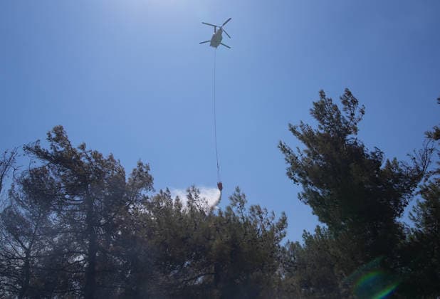 Firefighting efforts continue in Izmir IZMIR, TURKIYE - AUGUST 01: Turkish General Directorate of Forestry teams and firefighters, supported by aircraft, fight a forest fire in the Tinaztepe neighborhood of Buca district in Izmir, Turkiye on August 01, 2026. Aerial and ground teams continue efforts to bring the blaze under control. Berkan Cetin Anadolu Izmir Turkey. Editorial use only. Please get in touch for any other usage.  Copyright: x2026xAnadoluxBerkanxCetinx
