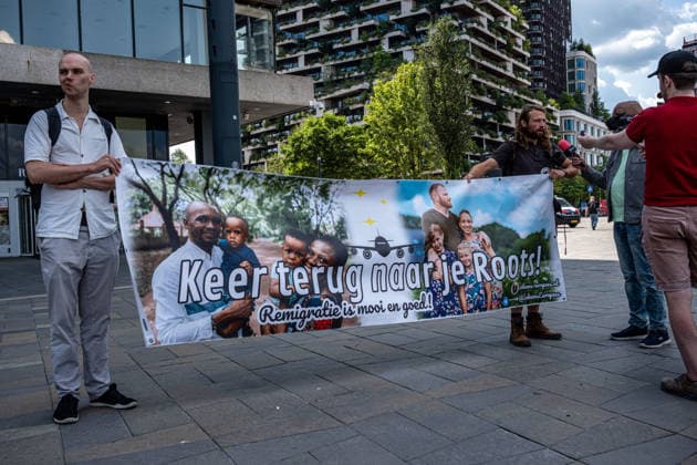 August 1, 2026, Utrecht, Utrecht, The Netherlands: Protestors holding a banner that reads Go back to your roots - remigration is great and a good thing . The organization Save Europe Act is kicking off the so-called European Shield Tour at Jaarbeursplein in Utrecht. During the demonstration, several participants are wearing clothing bearing the word Ã¢â‚¬ËœRemigration,Ã¢â‚¬â ¢ and a large banner with the same text is rolled out. Speakers are calling for remigration. Among those present, several Dutch flags and a Flemish flag are visible. Utrecht The Netherlands  - ZUMAg281 20260801_zaf_g281_026 Copyright: xStormxGroenendijkx