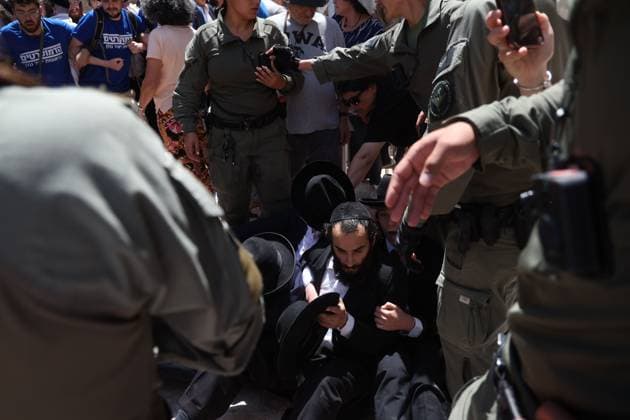 Ultra-Orthodox Protest in Jerusalem WEST JERUSALEM August 1, 2026: Ultra-Orthodox Jewish protesters clash with police officers and secular Jewish demonstrators during a protest against the opening of a cafÃ on Shabbat in West Jerusalem. The demonstration took place after protesters opposed the operation of the cafÃ during the Jewish day of rest. JERUSALEM Israel Copyright: x xSaeedxQaqx xJNAxPressx
