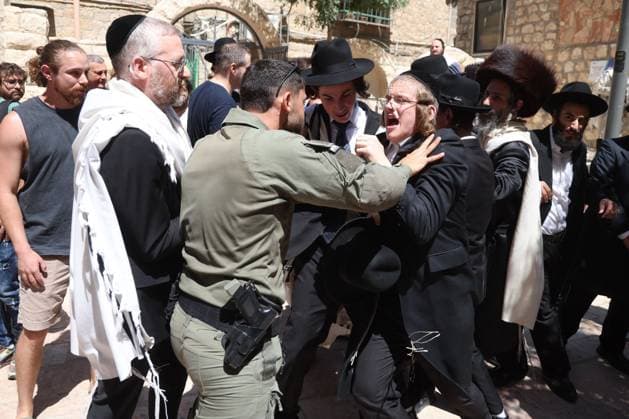 August 1, 2026, Jerusalem, Israel: WEST JERUSALEM Ã¢â‚¬ August 1, 2026: Ultra-Orthodox Jewish protesters clash with police officers and secular Jewish demonstrators during a protest against the opening of a cafo on Shabbat in West Jerusalem. The demonstration took place after protesters opposed the operation of the cafo during the Jewish day of rest. Jerusalem Israel  - ZUMAq101 20260801_zna_q101_133 Copyright: xSaeedxQaqx