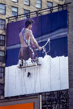 Billboard being hand painted on or near Times Square, Manhattan , New York City, NY, USA in June 1982 *** A billboard being hand-painted in or near Times Square, Manhattan, New York City, NY, USA, in June 1982