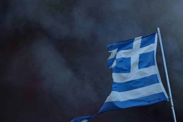 Wildfires in Western Attica, Greece ATTICA, GREECE - AUGUST 01: Smoke rises behind a torn Greece flag as wildfires continue in Agia Paraskevi, West Attica, Greece on August 1, 2026. Aris Oikonomou Anadolu Attica Greece. Editorial use only. Please get in touch for any other usage.  Copyright: x2026xAnadoluxArisxOikonomoux