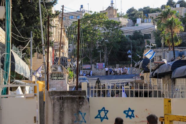 Israeli settlers raid Hebron under the protection of Israeli forces HEBRON, WEST BANK, PALESTINE - AUGUST 1: Israeli settlers raid the Old City area of Hebron under the protection of Israeli forces in Hebron, West Bank, Palestine on August 1, 2026. During the raid, Israeli forces blocked entrances and exits with metal barriers, restricting the movement of Palestinians in the area. Amer Shallodi Anadolu Hebron West Bank. Editorial use only. Please get in touch for any other usage.  Copyright: x2026xAnadoluxAmerxShallodix