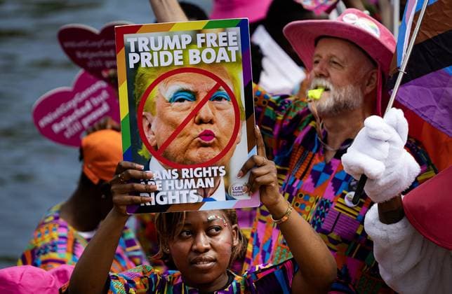AMSTERDAM - A participant holds up an anti-Trump sign during the Canal Parade. The boat parade is traditionally part of the Pride celebrations in the capital. RAMON VAN FLYMEN ANP netherlands out - belgium out  Copyright: xx x564702272x originalFilename: 564702272.jpg
