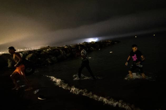 August 1, 2026, Ceuta, Spain: CEUTA, SPAIN - AUGUST 1, 2026: The arrival of migrants across the Tarajal border continues during the early hours of Saturday morning in Ceuta. Authorities maintain security and monitoring devices at the border crossing amid the ongoing influx. Ceuta Spain - ZUMAq101 20260801_zna_q101_056 Copyright: xSamuelxVegax
