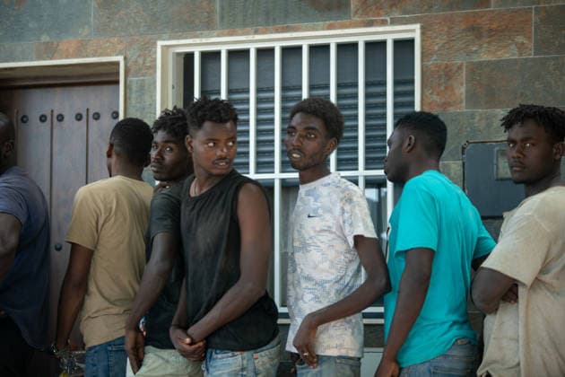 August 1, 2026, Ceuta, Ceuta, Spain: A group of migrants queue outside a small supermarket near the Temporary Stay Centre for Immigrants Ceuta Spain - ZUMAd308 20260801_zsp_d308_102 Copyright: xJuanxCarlosxLucasx