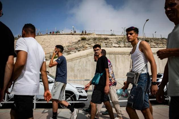 August 1, 2026, Ceuta, Spain: CEUTA, SPAIN - AUGUST 1, 2026: Migrants who remained in Ceuta cross back into Morocco through the Tarajal border crossing during the early morning hours. Ceuta Spain - ZUMAq101 20260801_zna_q101_107 Copyright: xSamuelxVegax