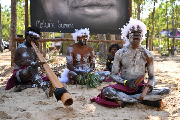 GARMA FESTIVAL, Ian Gurruwiwi, senior leader of the Galpu Clan (right) performs during the 26th annual Garma Festival in Gulkula, Northern Territory, Saturday, August 1, 2026. The Garma Festival takes place on the remote northeast Arnhem Land, celebrating Yolngu culture and customs in a four-day event hosted by the Yothu Yindi Foundation. ( NO ARCHIVING - VISUALS FROM THE YYF GARMA 26TH ANNIVERSARY ARE STRICTLY FOR NEWS AND CURRENT AFFAIRS COVERAGE ONLY. VISUALS MUST NOT BE USED FOR PROMOTIONAL, ADVERTISING, COMMERCIAL, FUNDRAISING OR ANY OTHER PURPOSE Gulkula Ceremonial Site Northern Territory Australia  Copyright: xJamesxRossx 20260802134911458200
