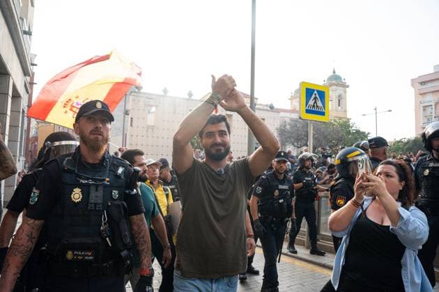 August 1, 2026, Ceuta, Spain: Spanish politician, social media influencer, and Member of the European Parliament. LUIS ALVISE PEREZ FERNÃNDEZ, 36, in Ceuta as police escort him out. Perez leads the anti-establishment and populist party Se Acabo la Fiesta (SALF), which translates to The Party Is Over. Gained prominence through guerrilla digital campaigns and anti-corruption messaging. Demonstrators gather in Ceuta to protest against far-right groups following calls for an anti-immigration rally after the arrival of tens of thousands of migrants. Authorities blocked the entry of members of the group Nucleo Nacional. Ceuta Spain - ZUMAq101 20260801_zna_q101_217 Copyright: xMarioxMorenox