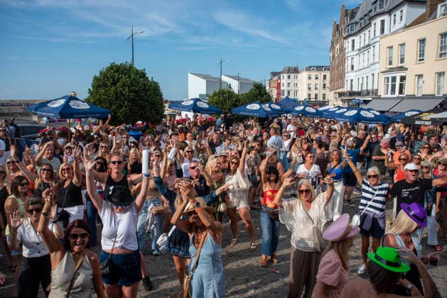 August 1, 2026, Margate, United Kingdom: Revellers wave to the camera during the Margate Soul Festival. The Margate Soul Weekender (also known as Margate Soul Festival) celebrated its 25th anniversary from Friday, July 31 to Sunday, August 2, 2026. It is widely recognized as the UK s largest independent soul street party and festival. Spanning three days, it transforms the seaside town into a massive celebration of soul, funk, jazz-funk, reggae, and R&B. Margate United Kingdom - ZUMAs197 20260801_aaa_s197_113 Copyright: xKrisztianxElekx