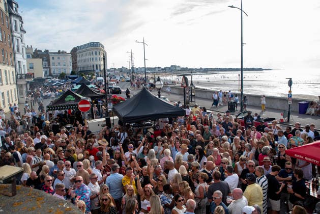 August 1, 2026, Margate, United Kingdom: Revellers wave to the camera during the Margate Soul Festival. The Margate Soul Weekender (also known as Margate Soul Festival) celebrated its 25th anniversary from Friday, July 31 to Sunday, August 2, 2026. It is widely recognized as the UK s largest independent soul street party and festival. Spanning three days, it transforms the seaside town into a massive celebration of soul, funk, jazz-funk, reggae, and R&B. Margate United Kingdom - ZUMAs197 20260801_aaa_s197_119 Copyright: xKrisztianxElekx